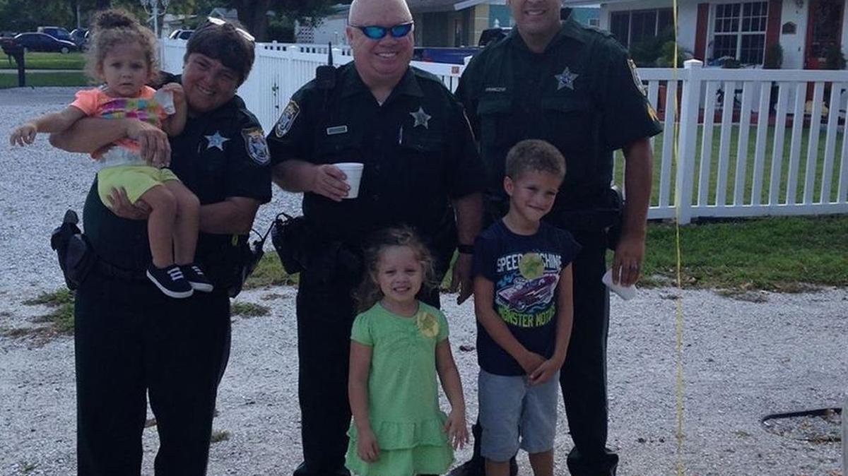 Members of the Manatee County Sheriff’s Office stop by a lemonade stand Saturday in Bradenton.