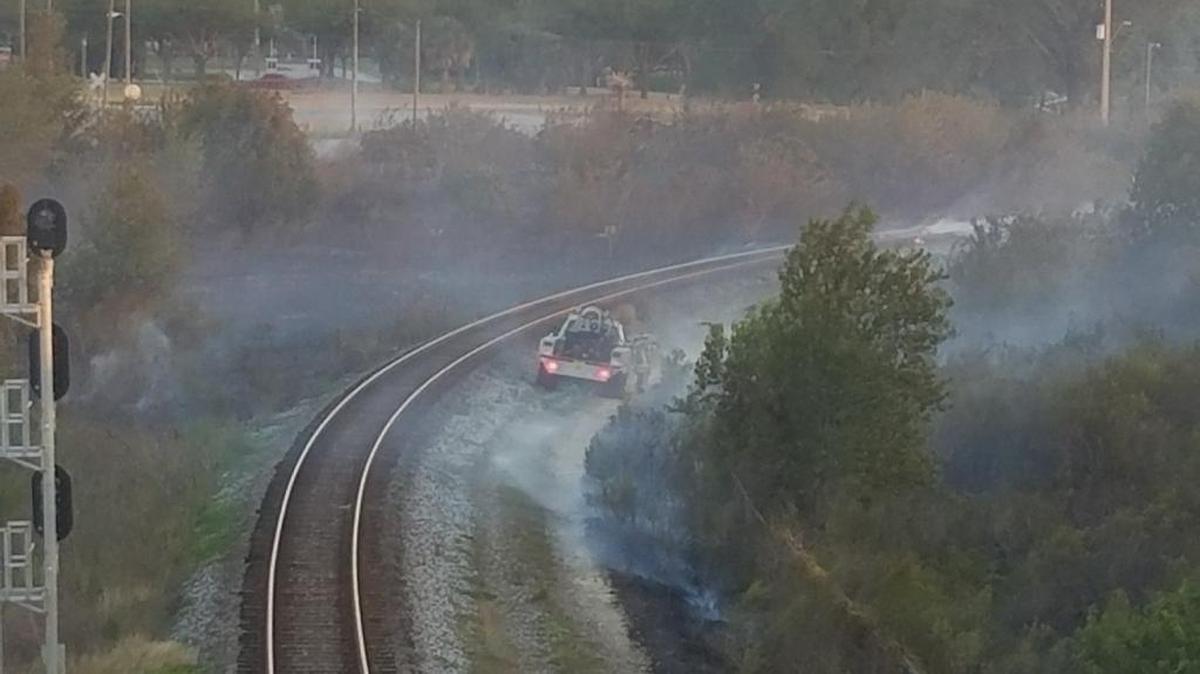 Crews continue to work the small brush fire in Lakeland Thursday morning.