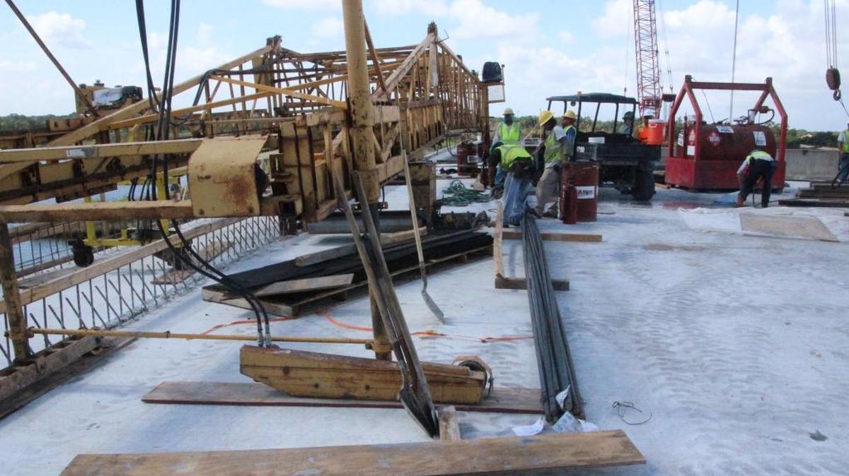 A Bid-Well concrete paving machine was to build the deck of the Fort Hamer Bridge and give the surface a brushed appearance. The bridge opens to vehicle traffic on Wednesday.