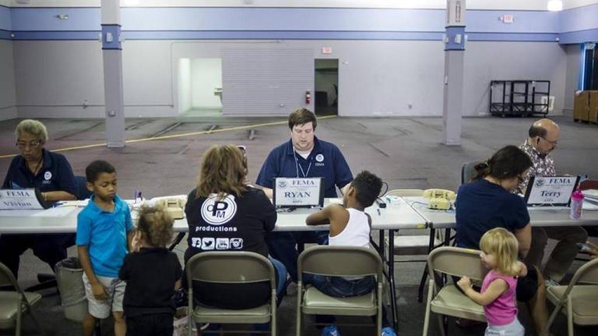 FEMA specialists help local residents sign up for recovery funds at a disaster recovery center set up at DeSoto Square mall in Bradenton. The center, which is open through Tuesday, offers in-person support from FEMA and other agencies.