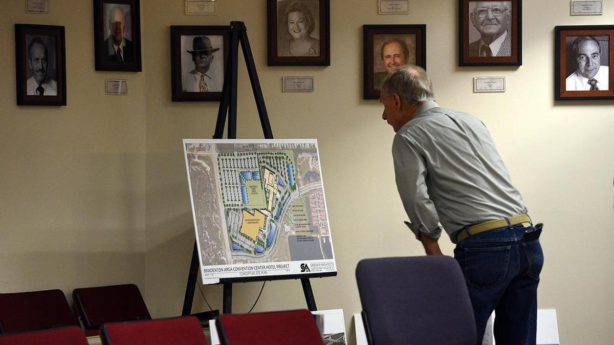 Paul Wires looks over plans as the Manatee County Commission meets to vote on Sept. 27, 2016 whether to enter a development agreement with Improvement Network Development Partners for a 250-room hotel adjacent to the Bradenton Area Convention Center.