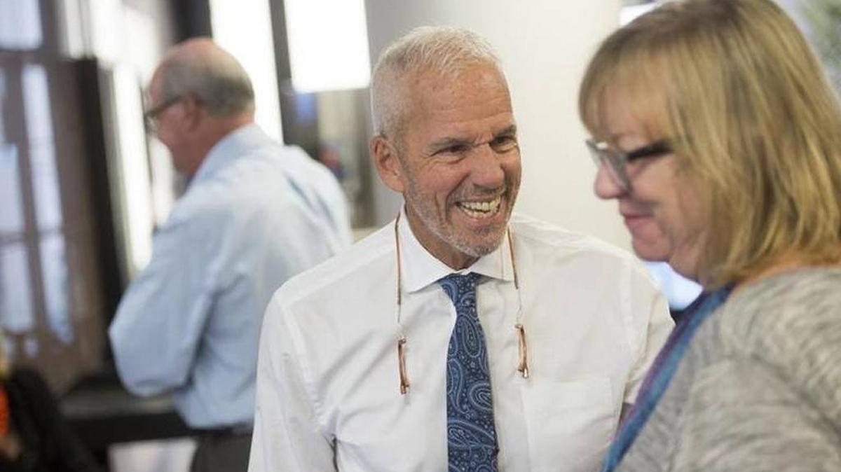 Former County Commissioner John Chappie laughs with guests during a farewell reception last November.