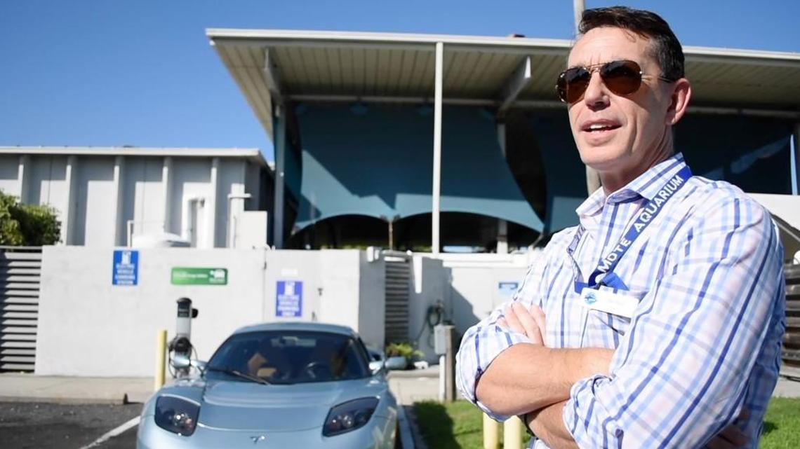 Nigel Mould talks about his Tesla Roadster during a media event ahead of Mote’s fourth annual “Electrify the Island” event on Saturday, Sept. 10.