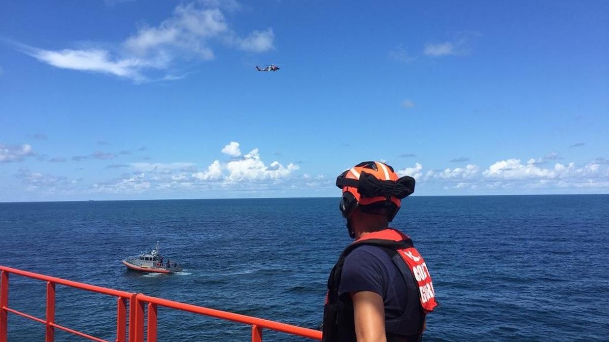Petty Officer 3rd Class Gage Hunt, a crewmember from Coast Guard Station Cortez, assists with the medevac of a 55-year-old man from the 550-foot tanker, Gaschem Stade, 13 miles west of Egmont Key, Florida, Monday, Aug. 14, 2017. An MH-60 Jayhawk helicopter air crew from Air Station Clearwater medevaced the 55-year-old man to Tampa General Hospital.