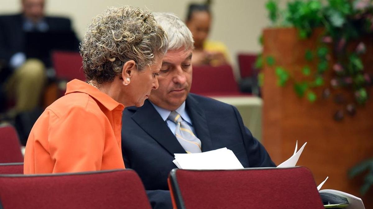 Manatee County Commissioner Robin DiSabatino sits with her attorney, Ralf Brookes, as she asks her fellow commissioners to reimburse her for legal fees incurred in a lawsuit.
