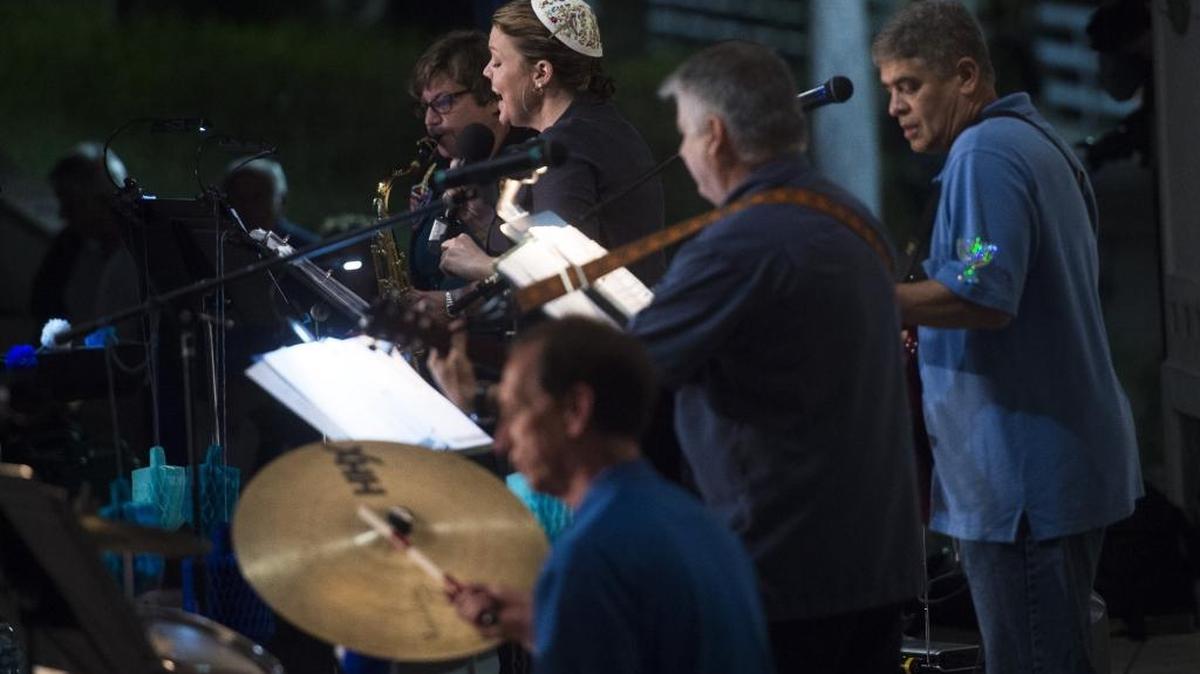 The Temple Beth El band plays “I Have A Little Dreidel” during a Hanukkah celebration on Wednesday evening at the Riverwalk Amphitheater in downtown Bradenton.