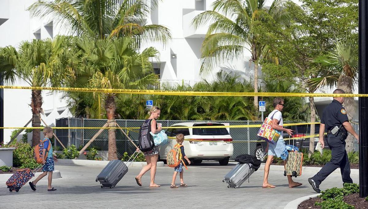 Guests are escorted through the parking lot during a double-homicide investigation at the luxury Zota Beach Resort on Longboat Key in 2017.