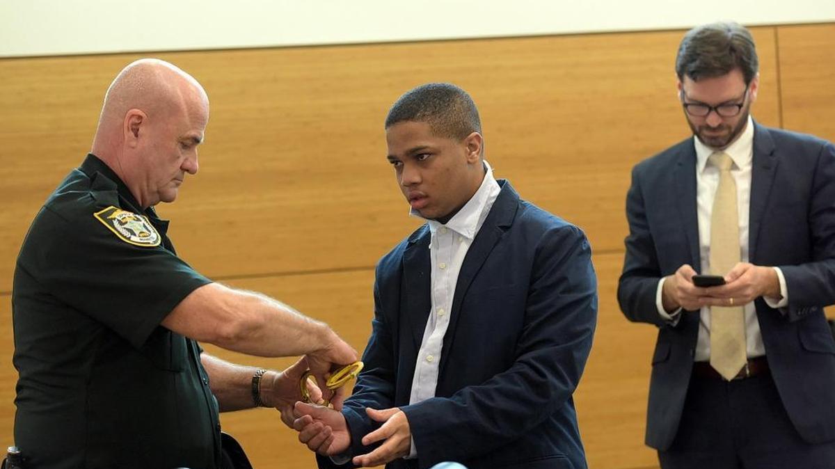 Jamari Lamon Murray-Barnes is handcuffed Friday by a bailiff as the jury begins its deliberations. Murray-Barnes was found not guilty of second-degree murder with a firearm in the 2015 fatal of another teen, Justin Fabien.
