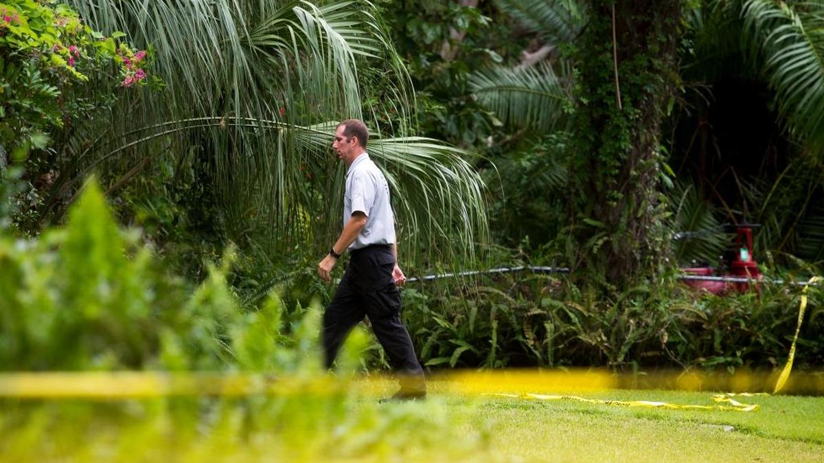 Investigators examine a homicide scene where an 82-year-old woman was killed in Bradenton in October.