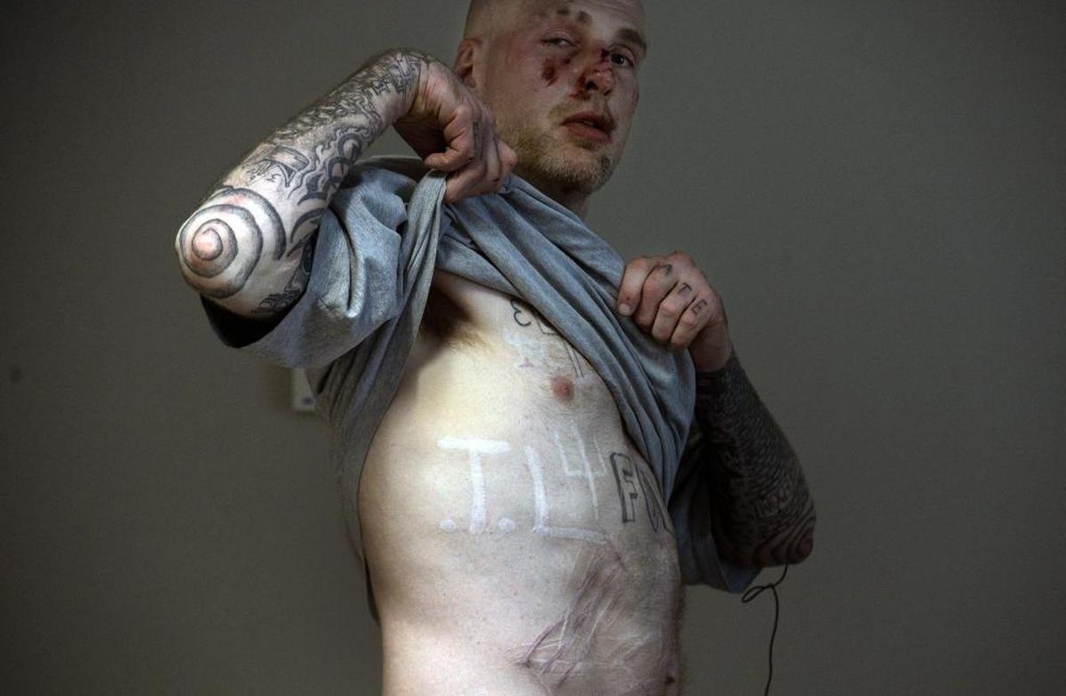 Christopher Cook, released from prison in March, has branded the letters “T.L.” into his body. The letters stand for “Thug Life,” the nickname of Cook’s friend Wesley Turner who was stabbed to death at Lanesboro Correctional Institution in 2012.