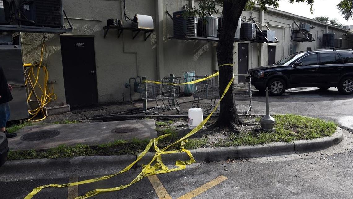 Crime scene tape is draped around a tree and on the ground near where Cory Iwanski, 20, was discovered deceased in a car behind Katie's Cafe in Bradenton. His mother reported him missing Saturday, according to law enforcement.