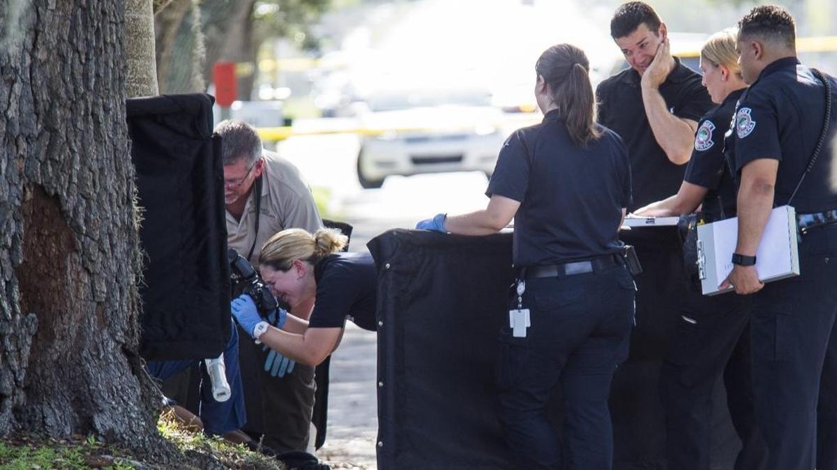 Police investigate a third body found nine miles away from the Bayshore Gardens double homicide on Saturday morning on the corner of Yale Avenue and Bahia Vista Street in Sarasota.