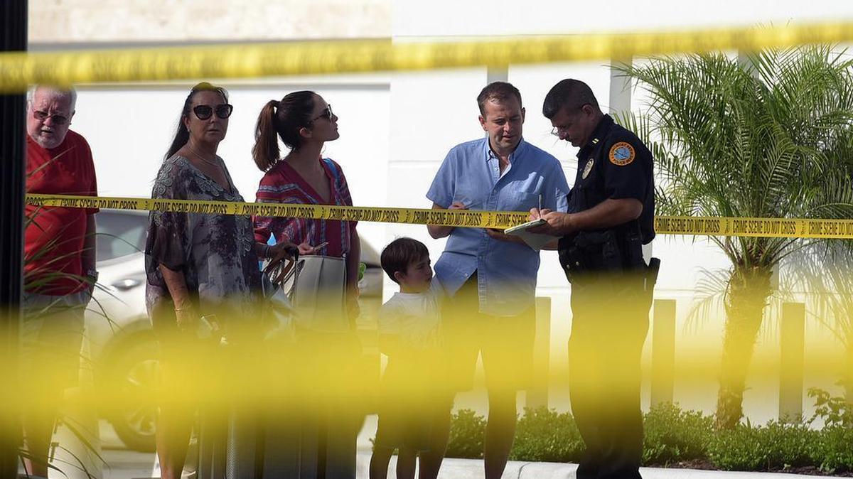 Guests talked to a law enforcement officer during a double-homicide investigation at the luxury Zota Beach Resort on Longboat Key in 2017.