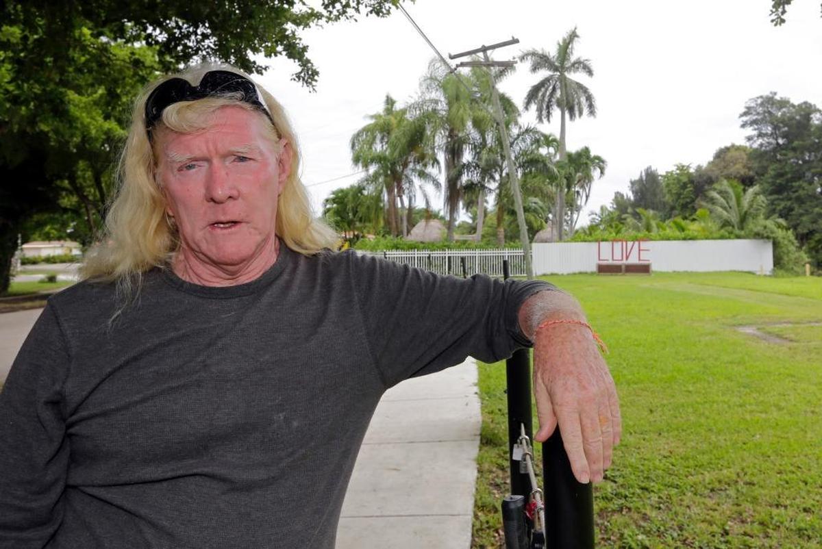 In this Aug. 11, 2016 photo, Mickey Munday talks to a reporter in Love Park in North Miami, Fla. Federal prosecutors want to use Munday’s past as a cocaine cowboy against him during an upcoming trial on charges of participating in an auto fraud ring.