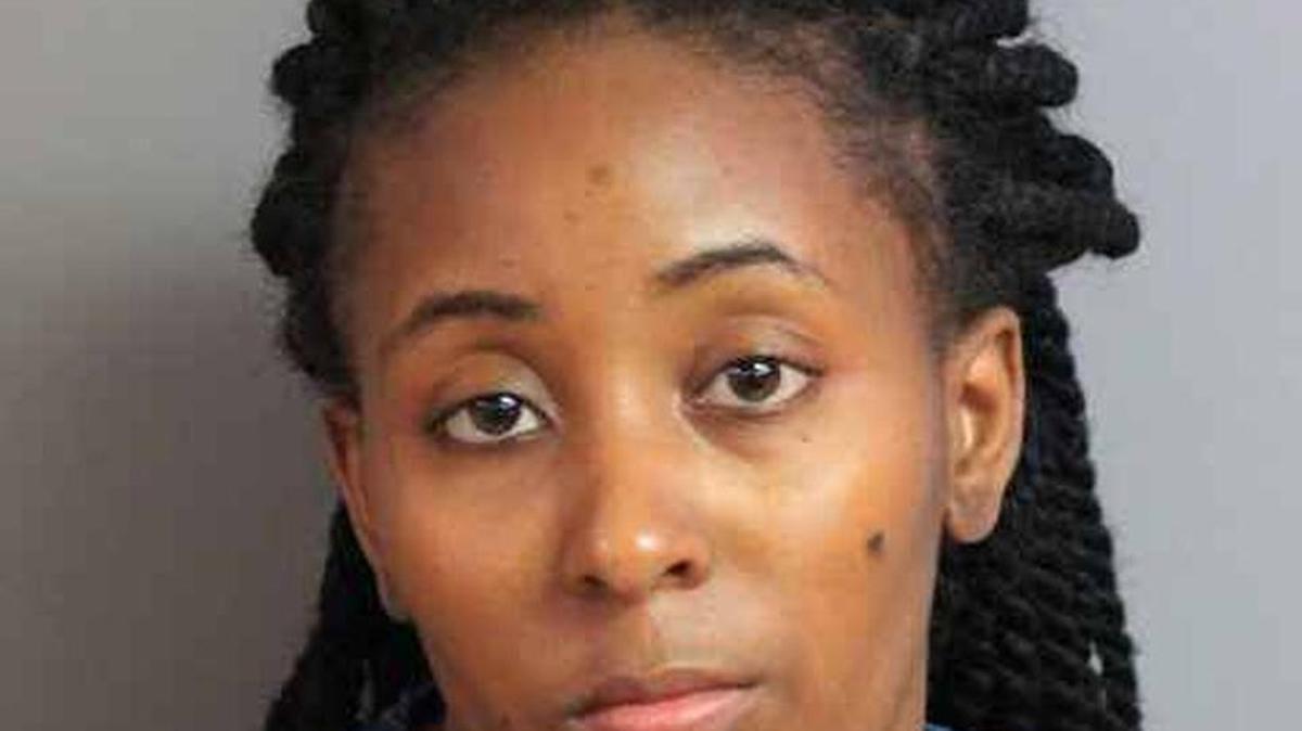Laymeshia Hicks, a former DCF child protective investigator, turned herself in Monday after a warrant was out for her arrest on drug trafficking charges.