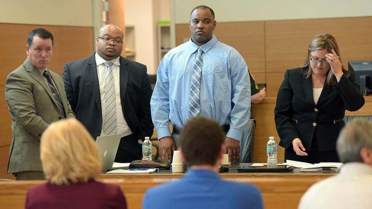 Jury selection was underway Monday in trial of Dwayne Cummings, second from right, charged with two murders in 2016. Standing as potential jurors arrive are, from left, defense investigator Andrew Carlton, attorney DeMone Lee, Cummings and attorney Lily McCarty Gonzalez.