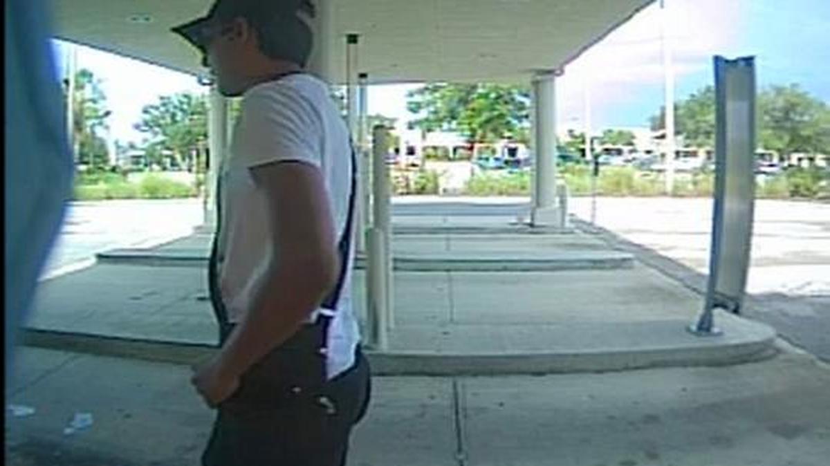 The Manatee County Sheriff’s Office released this photo of a suspect placing a credit card skimmer on an ATM at SunTrust Bank on June 28. Another skimmer was discovered at a gas station in Bradenton June 30.