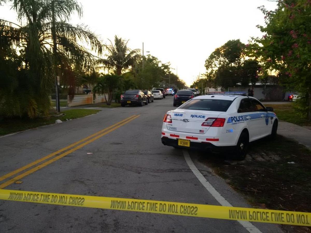 The shooting scene on Northwest 18th Avenue from 60th Street, Sunday, December 24, 2017.