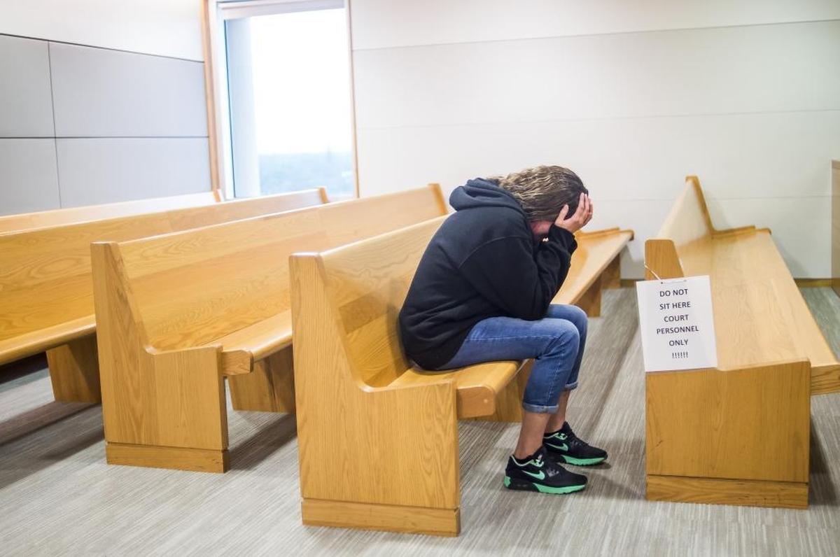 Jimmy McNear's mother breaks down crying, alone in the rows of seats as her son is found guilty of second-degree murder, manslaughter and armed burglary in the 2015 fatal shooting of Kantral Brooks and his girlfriend Esther Deneus on Thursday evening at the Manatee County Courthouse in downtown Bradenton.