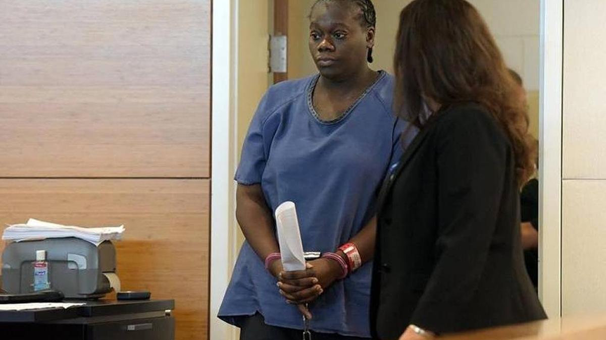 Keishanna Thomas enters the courtroom with her attorney to take a plea for murdering, abusing and hiding 11-year-old Janiya's body in a cardboard box inside a padlocked freezer.