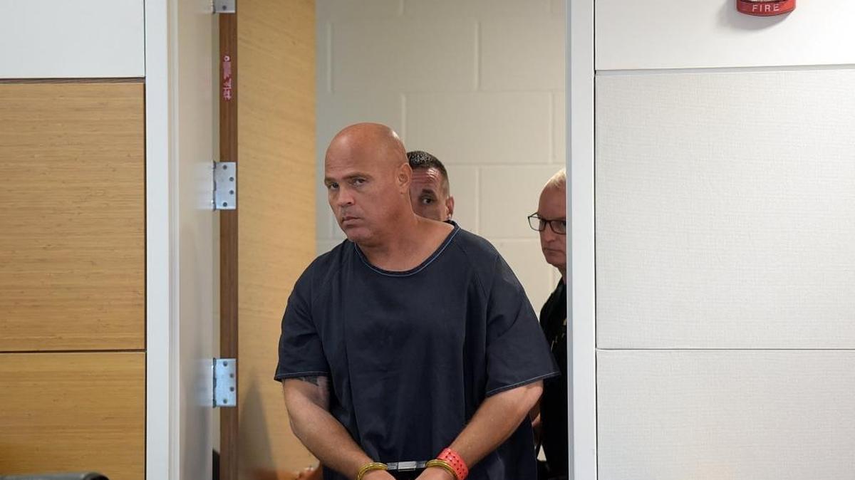 Delmer Smith is escorted by deputies Monday morning into Judge Diana Moreland's courtroom in the Manatee County Judicial Center for day one of Smith's evidentiary hearing for post-conviction relief.