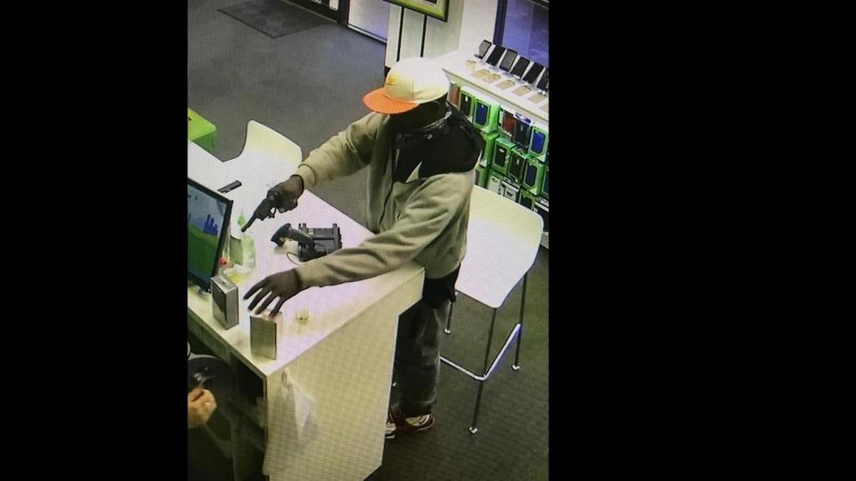 An image taken from the surveillance video of a Cricket Wireless store in Oneco shows the suspect who deputies say robbed the cell phone store at gunpoint.