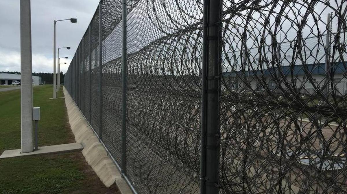 Two Florida corrections officers have been arrested after allegedly spraying an inmate in the face with chemicals and locking him in a supply closet, still covered in toxic residue as he begged to be let out, documents show.