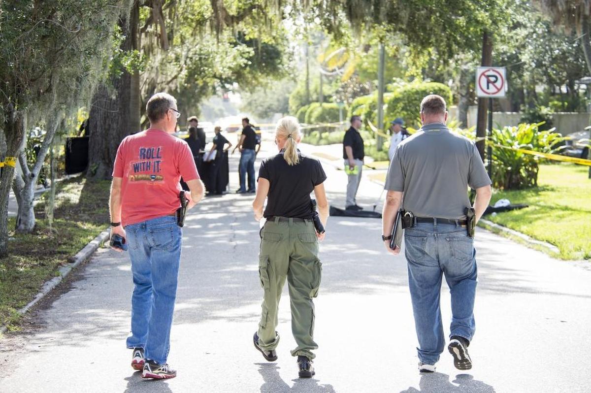 Police investigate a third body found nine miles away from the Bayshore Gardens double homicide on Saturday morning on the corner of Yale Avenue and Bahia Vista Street in Sarasota.