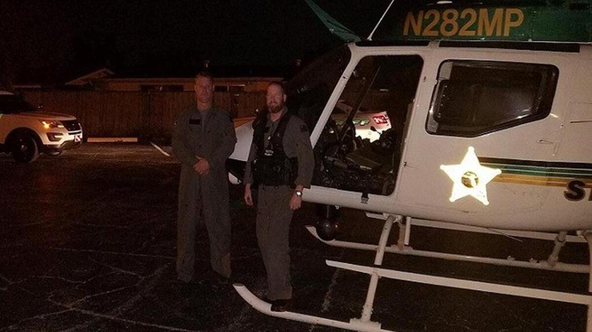 Helicopter pilot Stephen Bowman (left) helped arrest a man pointing a laser at his aircraft on Tuesday night. (Pasco County Sheriff's Office)
