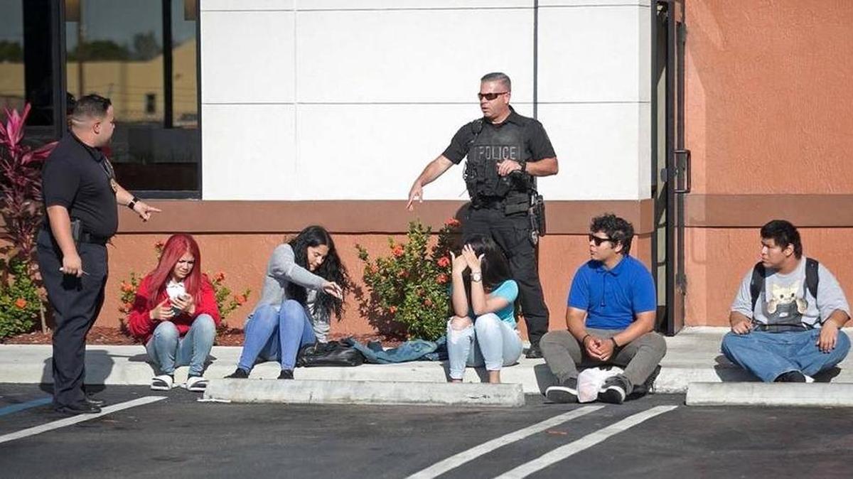 City of Hialeah police speak to possibble witnesses of an after-school fight and stabbing at a Wendy's on Palm Avenue and 49th Street in Hialeah. Eduardo Rivero, 18, was stabbed in the back during a fight on Wednesday, March 8, 2017.