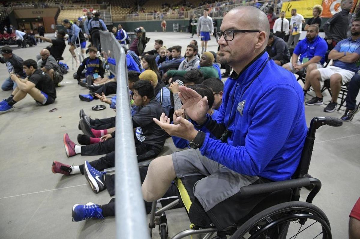 South Dade principal Javier Perez, who was critically injured by a motorist in April 2016, watches a wrestling match in Kissimmee in March. He and his wife appeared in court on Friday but did not speak.
