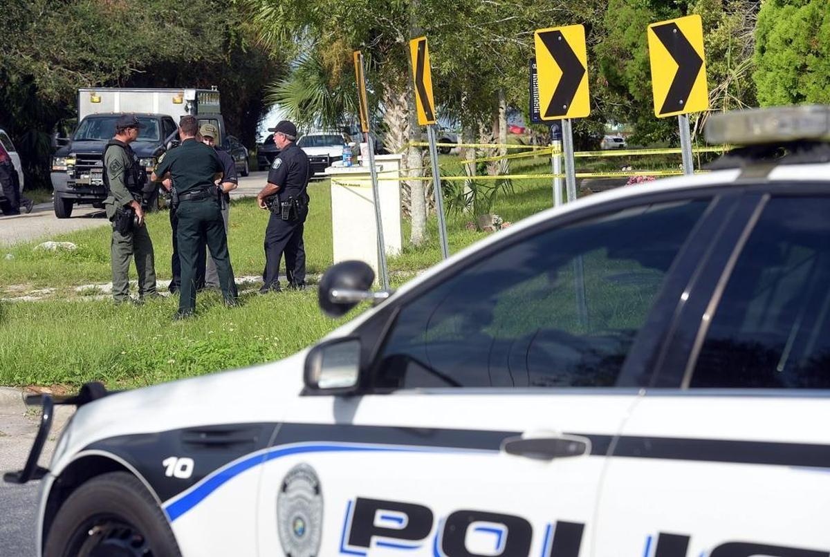 Police officers stand during an investigation in Palmetto where at about 2 a.m., an incident near 25th Street West and Bayshore Road ended with a Palmetto police officer fatally wounding someone, Chief of Police Scott Tyler confirmed.