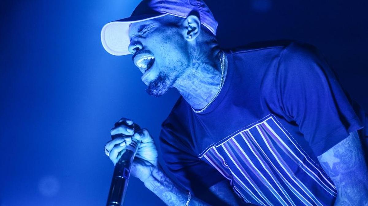 FILE - In this Friday, Dec. 18, 2015 file photo, Chris Brown performs at the Hollywood Palladium in Los Angeles. Brown has been accused of punching a Tampa-area nightclub photographer. (Photo by Rich Fury/Invision/AP, File)