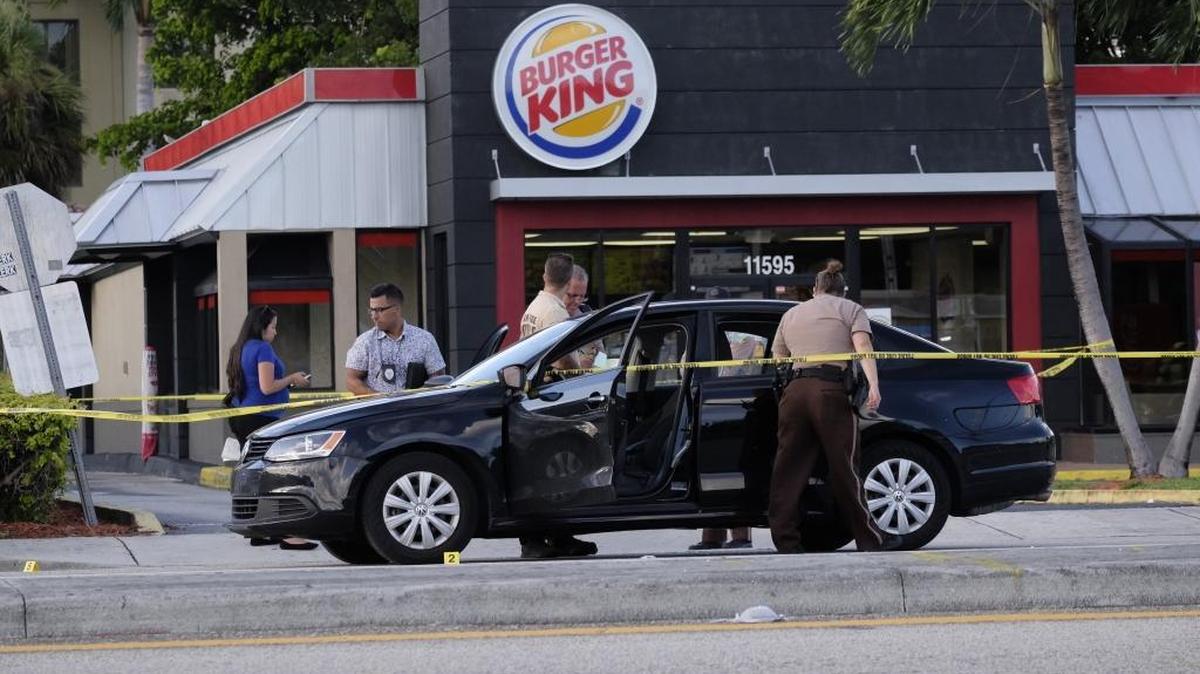 Miami-Dade police arrested two men Tuesday after a gunfight erupted when they harrassed workers at Kendall Burger King and tried to videotape the incident.