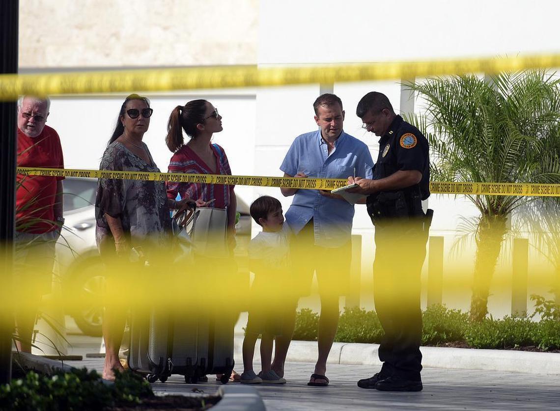 Guests talk to a law enforcement officer at a double homicide investigation at the luxury Zota Beach Resort on Longboat Key in 2017. Two resort employees were killed during an armed robbery.