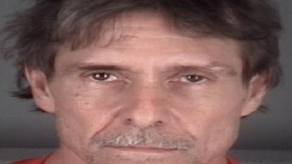 Russell Smith was arrested after deputies say he entered a home and laid down in bed with a woman.