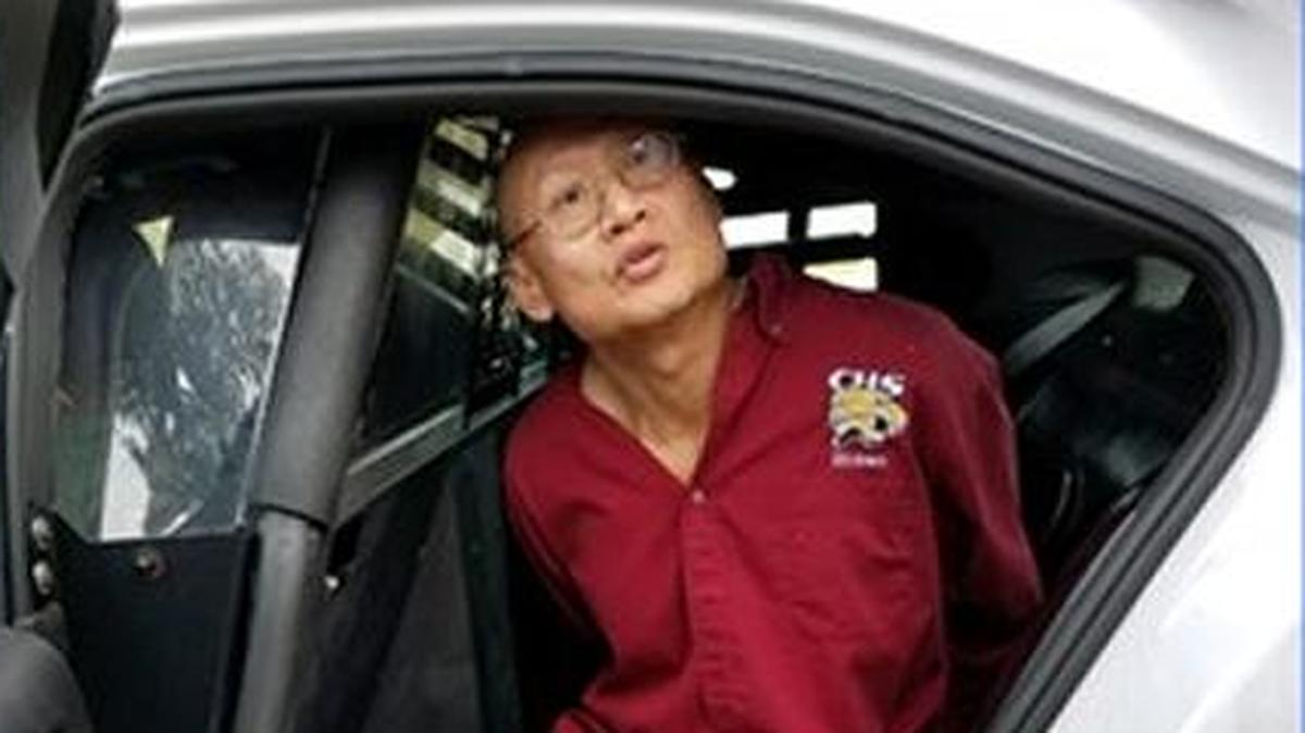 Qui Feng Ke, 60, inside a Pasco County Sheriff's Office patrol car following his arrest in connection with the murder of his neighbor, Tuesday, Jan. 23, 2018.