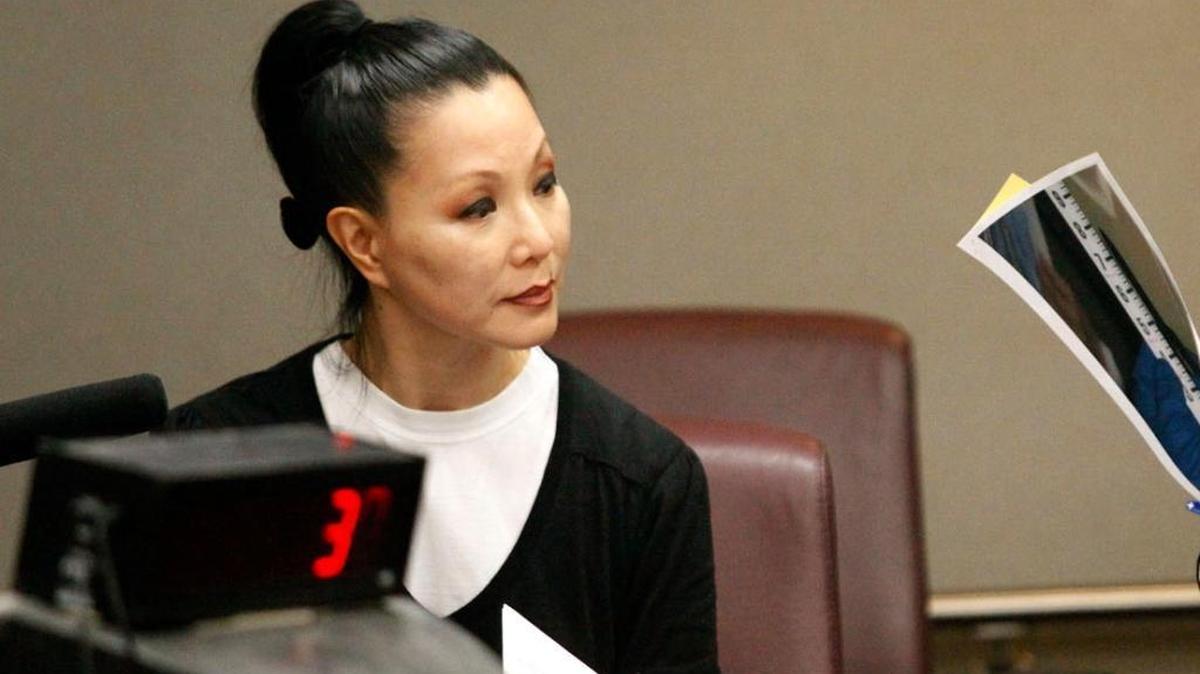 Miami-Dade Medical Examiner Emma Lew said her office is straining to put a dent in the task of confirming a backlog of suspected COVID-19 deaths.