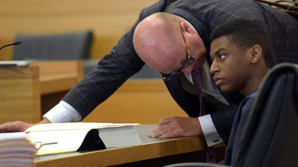 Attorney Bjorn Brunvand talks with client, Trey Nonnombre Monday. The state will no longer be seeking the death penalty against Nonnombre for the fatal shootings of Kantral Brooks and his girlfriend, Esther Deneus, during an armed home invasion in the home they shared.