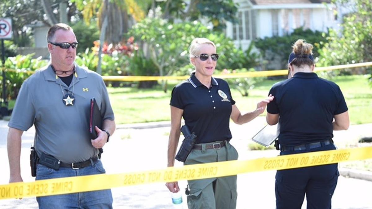 Homicide Detective Jeffrey Bliss, left, with the Manatee County Sheriff’s Office works with Sarasota Police Lt. Lori Jaress, center, on recent murder investigations.