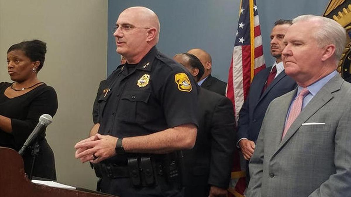 Tampa police Chief Brian Dugan speaks at a press conference about the arrest of suspected serial killer Howell Donaldson with sign language interpreter Derlyn Roberts on his left.