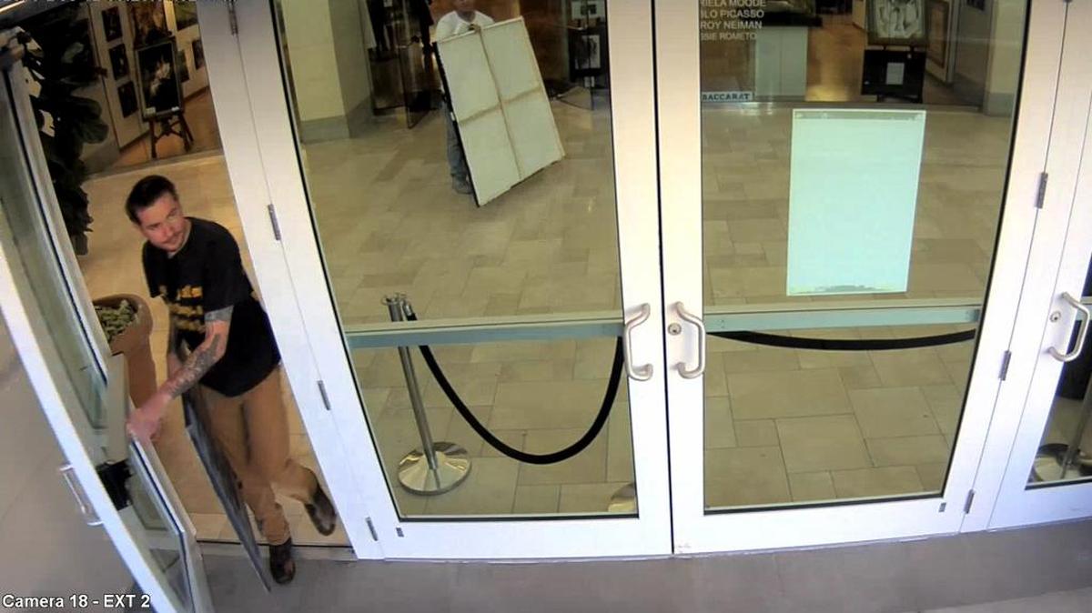 Surveillance footage of two men stealing paintings at Art Avenue in Sarasota on Dec. 12, 2016.