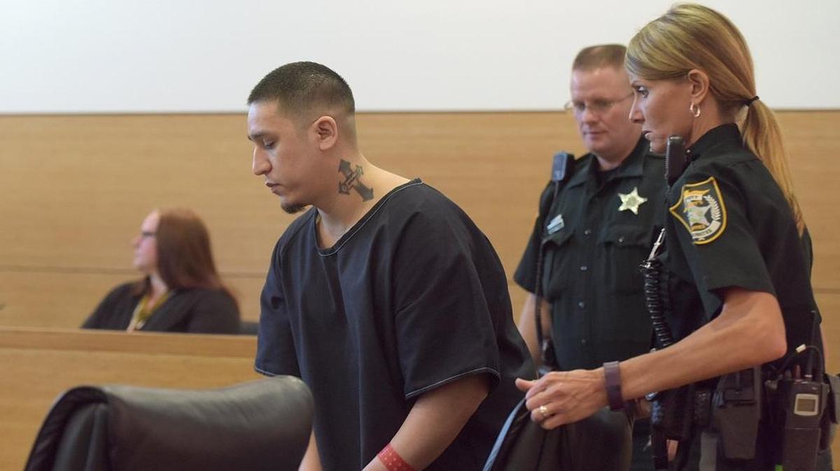 Andres “Andy” Avalos Jr. is escorted by bailiffs in court for a status conference hearing with his case set to go to trial beginning May 8. The Florida Supreme Court has not yet made a ruling in the defense’s motion to eliminate the death penalty as a possibility in this case.