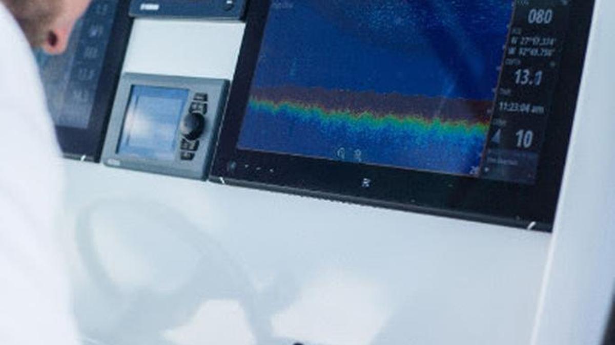 Dr. Jordon Beckler, Ocean Technology Research Program manager at Mote, records data on water samples during a mission to deploy ocean-sensing technology at sea. Beckler and his colleagues will work with high-school and teacher members of Mote's new Ocean Technology Club.