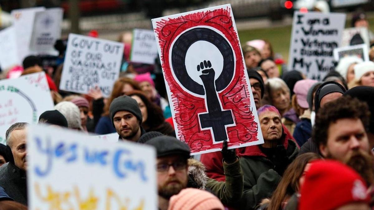 Participants holds signs as they gather near the Ohio Statehouse steps during the Womens March on Washington - Ohio Sister March on Washington in Columbus, Ohio on Sunday, Jan. 15, 2017.