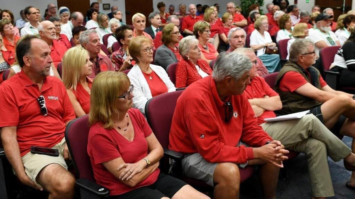 County commissioners decide on whether to establish a MSTU that would be used to buy land for a preserve. Those in red shirts are mostly opposed to the mechanism to fund the preserve, and white shirts support the MSTU and preserve.