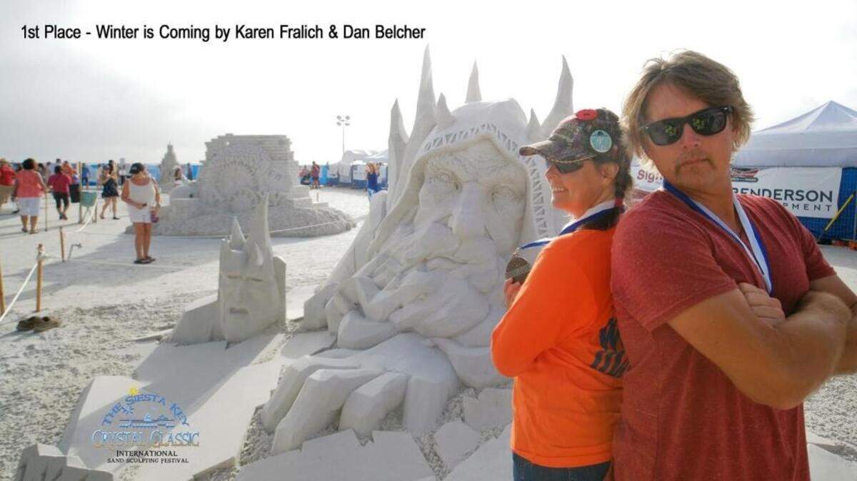 Karen Fralich (left), of Canada, and Dan Belcher, of the U.S., took first place with their sculpture “Winter is Coming.”