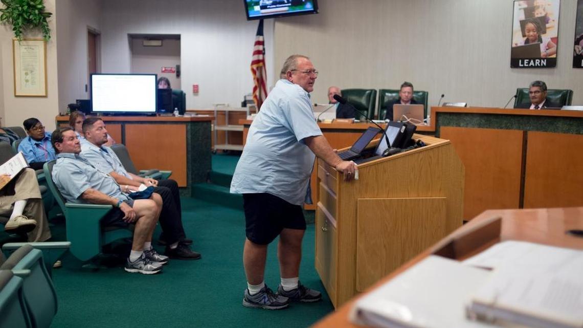 Robert Hicks, a school bus driver, voices complaints about rising insurance rates and the understaffed fleet of drivers as Manatee County Public School bus drivers gather to protest working conditions a school board meeting on Tuesday at the Manatee County School District building in Bradenton.