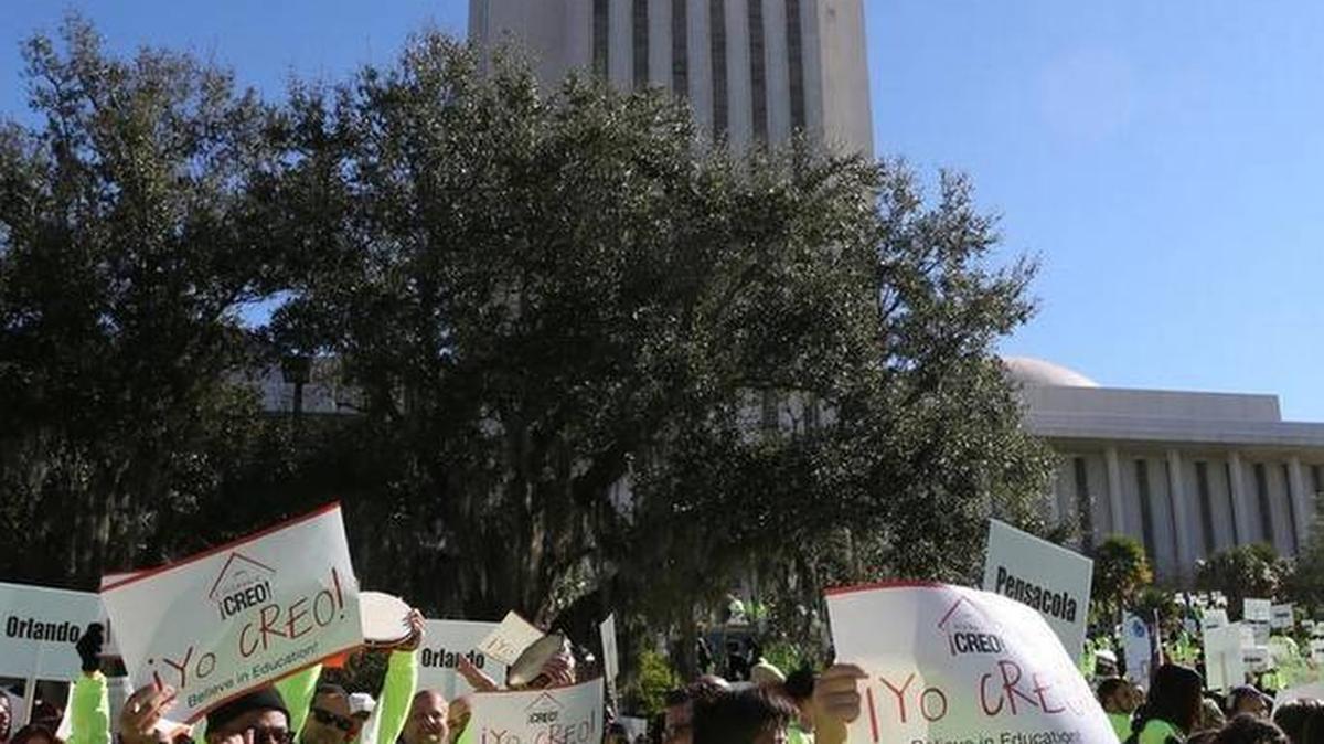 Demonstrators march on the Florida Capitol as they rally in support of the school voucher program Jan. 19, 2016.