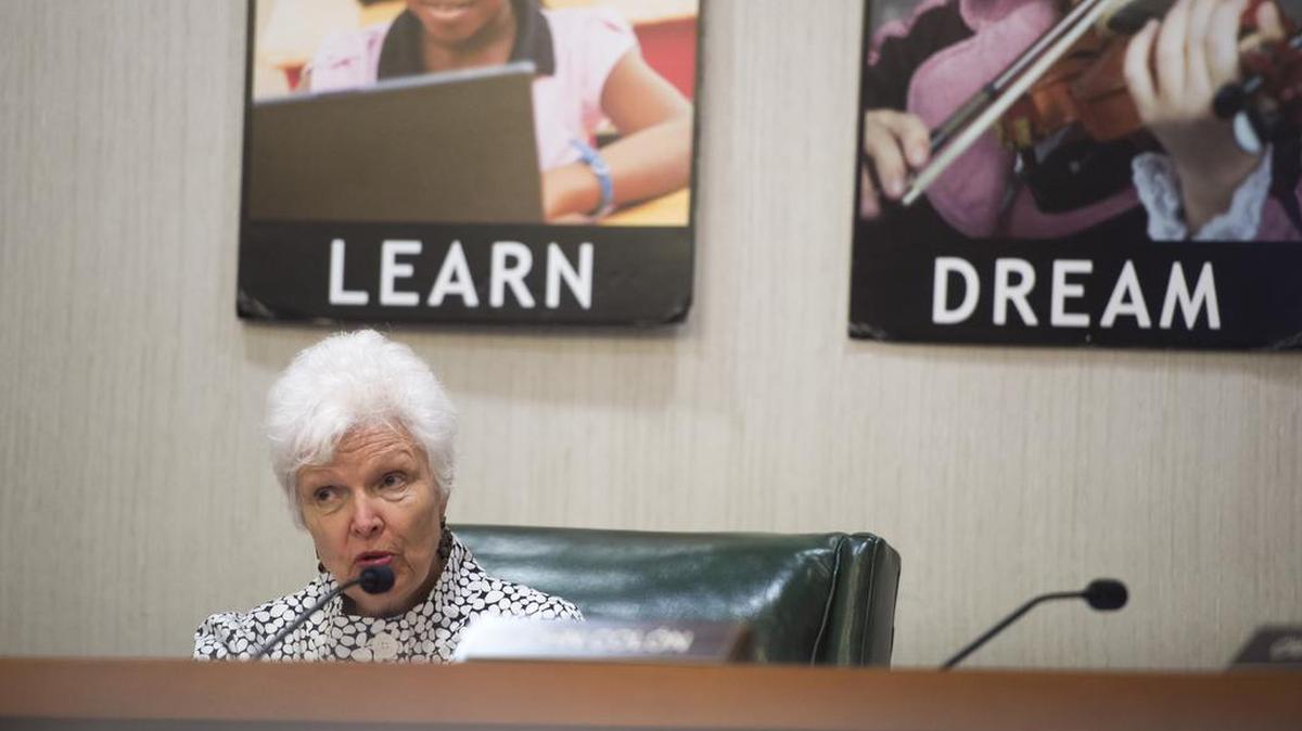 School board member Karen Carpenter speaks to Wylene Herring-Cayasso during a school board meeting Tuesday evening in Bradenton.